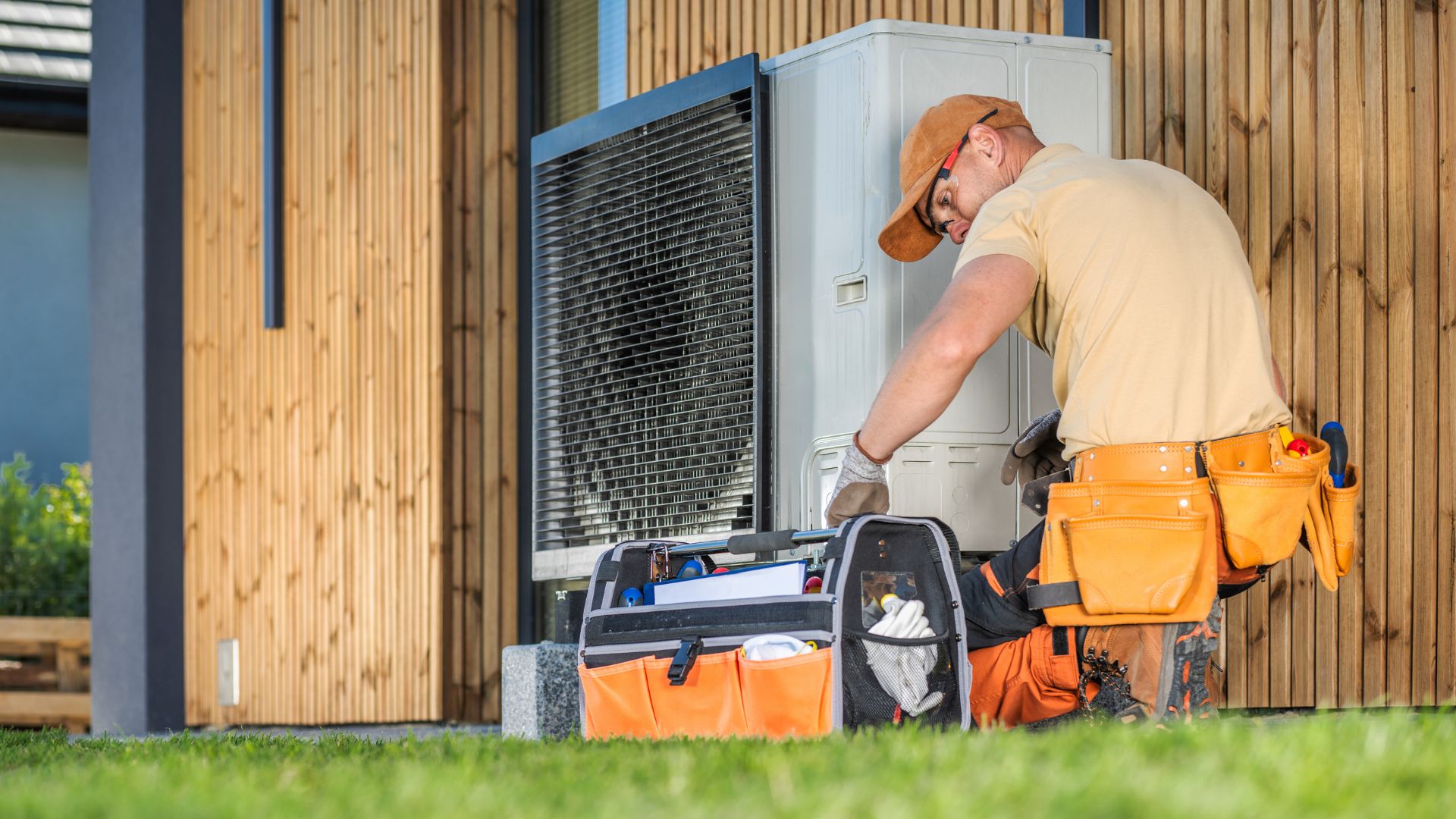 Norse Home Solutions team offering expert Minnesota heating services | Technician performing heat pumps repair in a residential home
