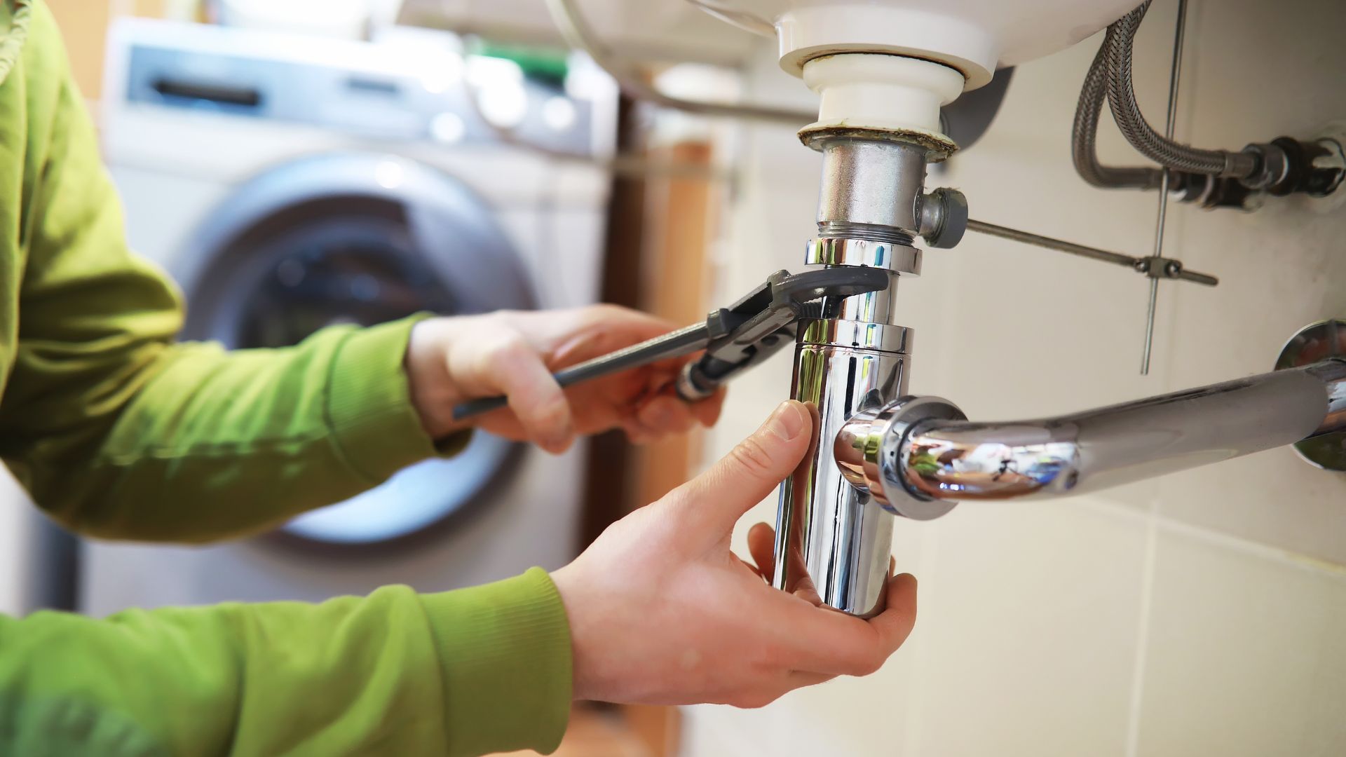 Plumber repairing pipes for Minnesota plumbing services