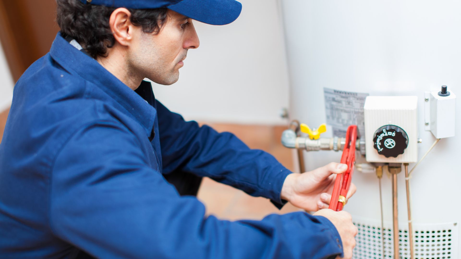 Technician installing water heater as part of Minnesota plumbing services