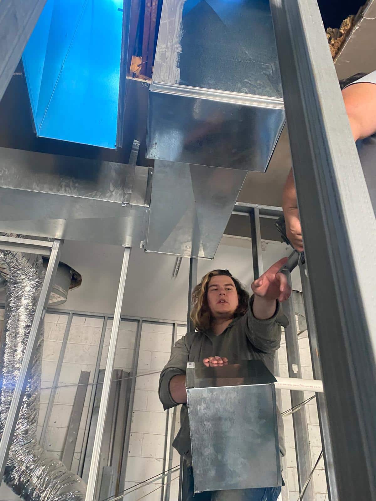 Our crew is hard at work installing custom ductwork at one of our commercial projects