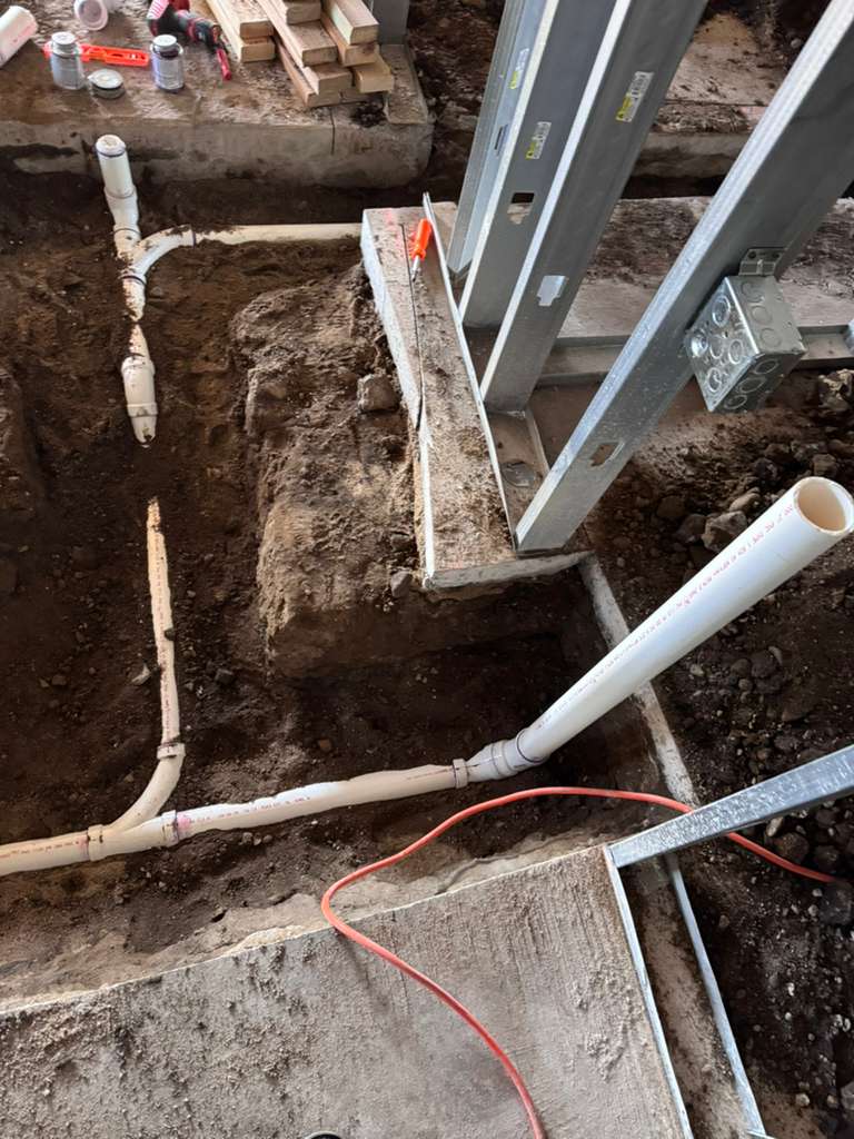 Our crew is hard at work, laying the plumbing groundwork