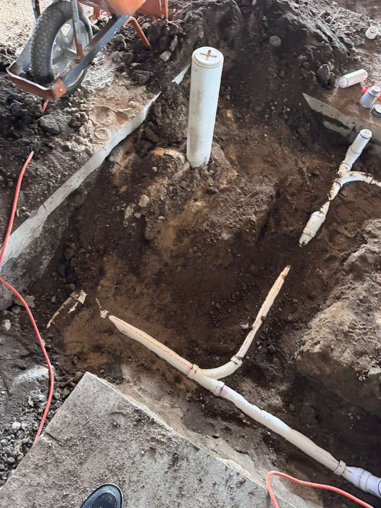 Our crew is hard at work, laying the plumbing groundwork