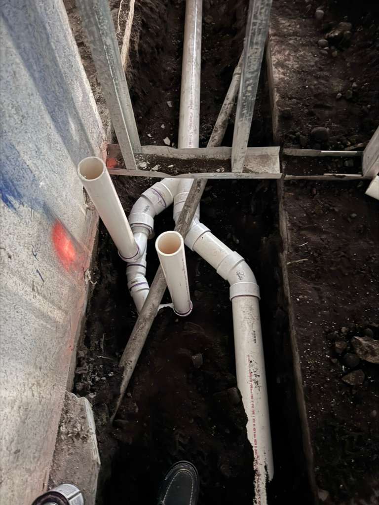 Our crew is hard at work, laying the plumbing groundwork