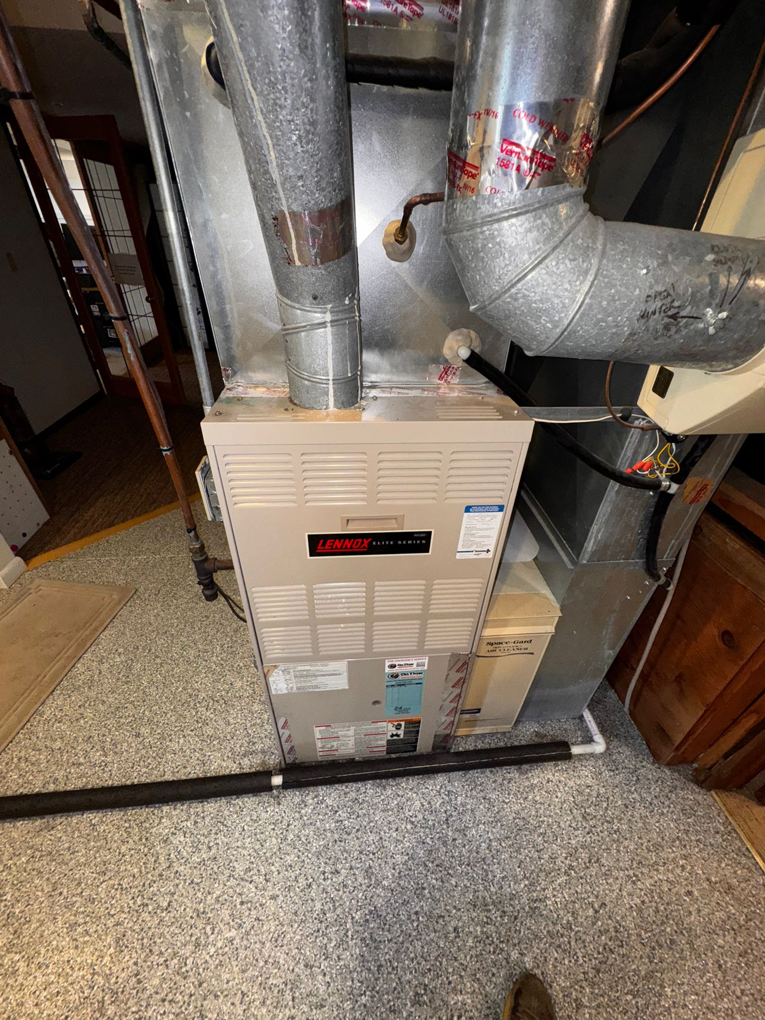 home hvac system inspection with technician checking filters and components